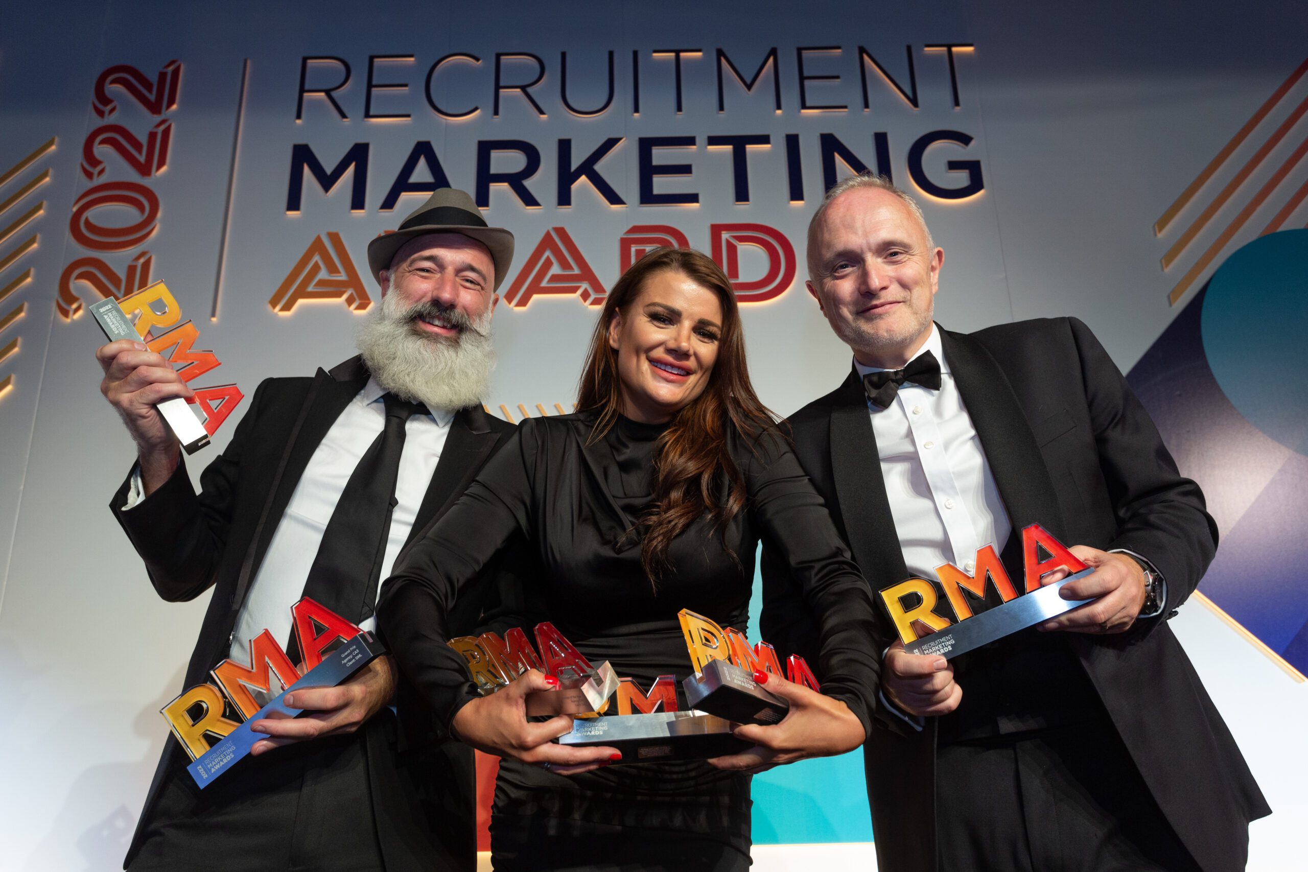 00018-Carmen-Valino-Event-Photography-London Woman and men smiling with awards London event photography