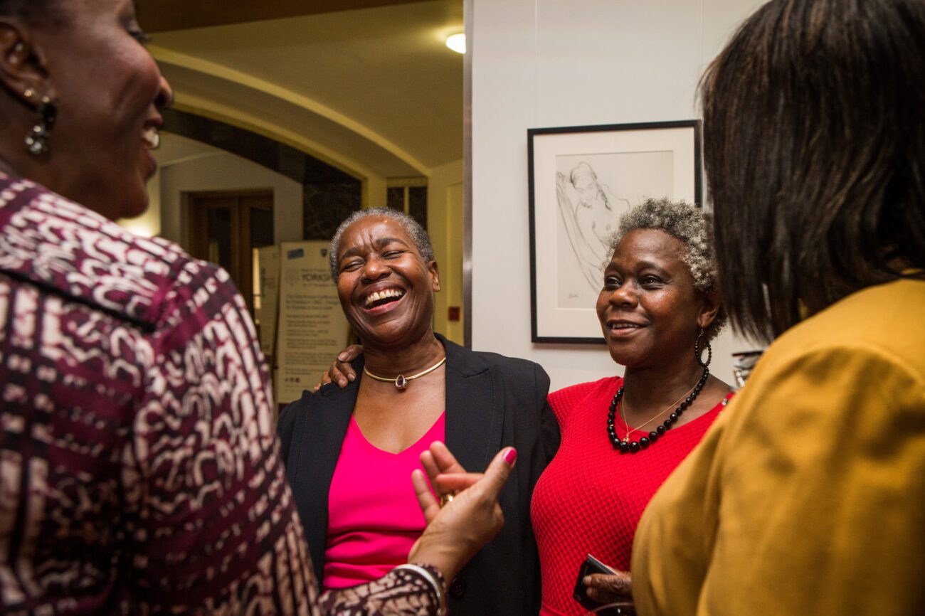London event photography a moment of laughter and connection during a networking event for the Royal College of Midwives