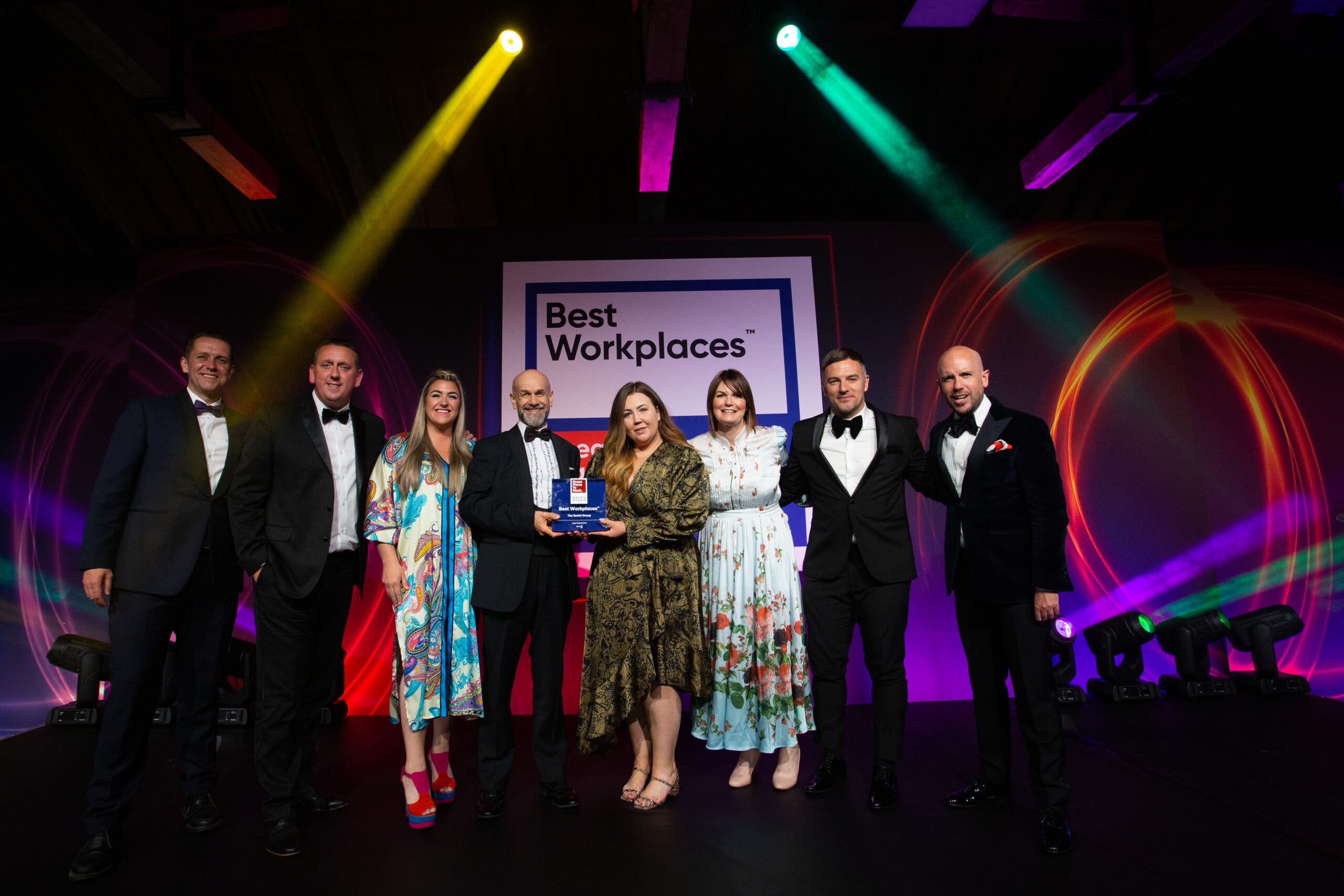 001-AWARDS-PHOTOGRAPHER-LONDON-TOBACCO-DOCK Winners on stage at Great Places to Work Awards Dinner at Tobacco Dock London - Carmen Valino Event Photographer