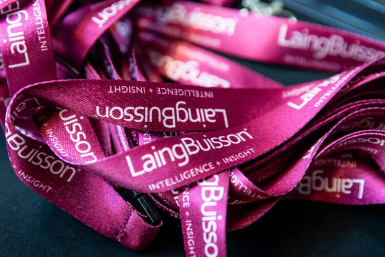 Event Photographer at Thee View Royal College of Surgeons in Central London - LaingBuisson Lanyards are displayed at the registration desk