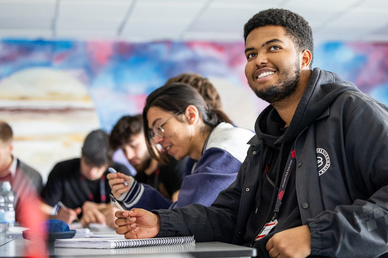 Education Photography A Six Form Student at Alexandra Park School in North London smiles during a science lesson