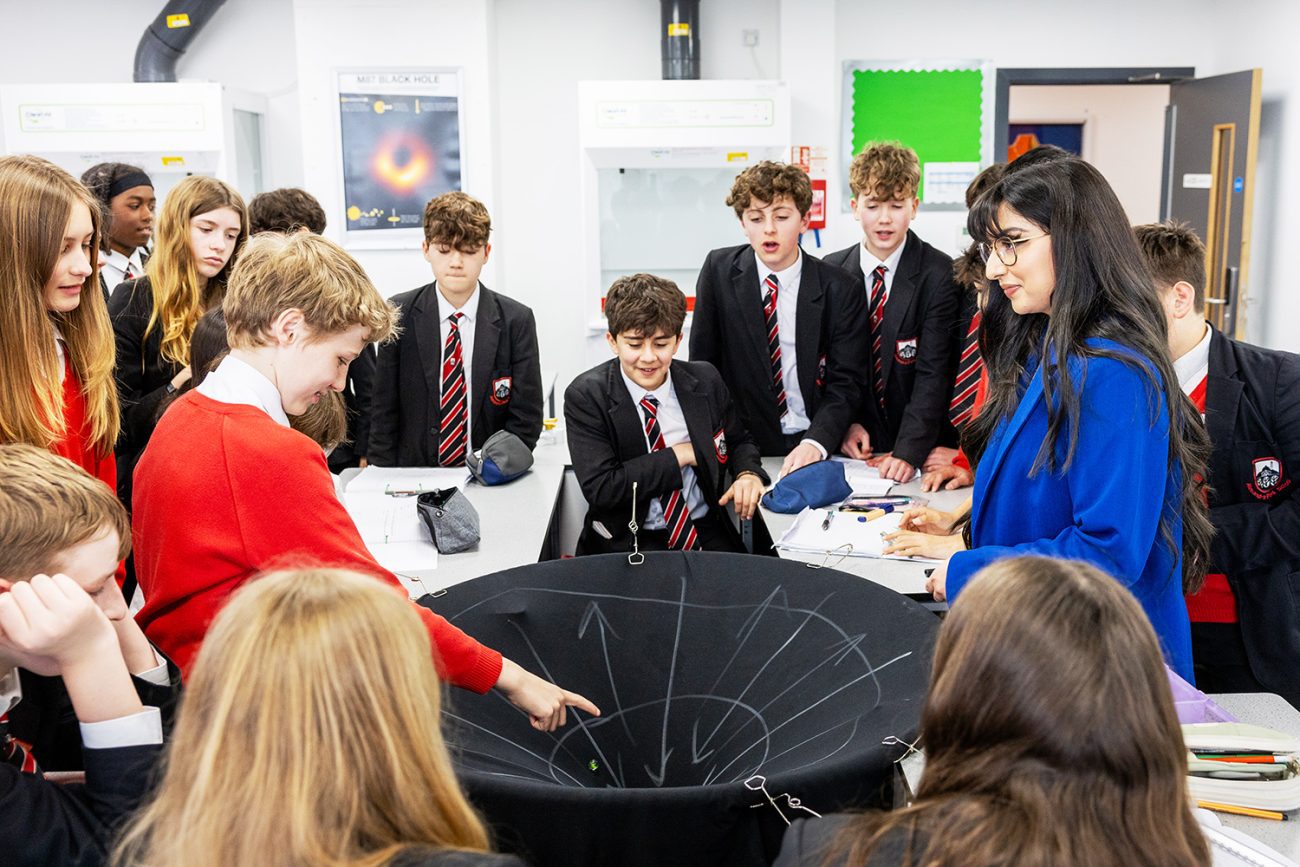 Professional education photography a group of secondary students from Alexandra Park School in North London during a science experiment in the classroom
